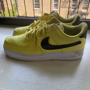 Yellow leather Nike Airs with velcro Nike sign.